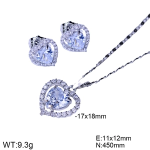 Detail view of heart-shaped zircon necklace and earrings set with dimensions in silver