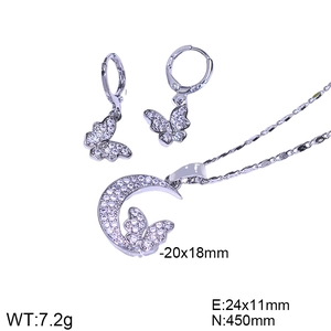 Detailed view of silver butterfly necklace and earrings set with sparkling zircon stones