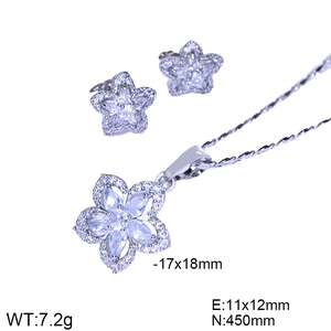 Detailed view of silver flower jewelry set with dimensions of necklace and earrings