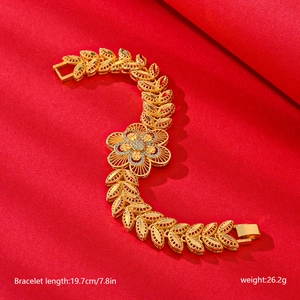 Detail view of flower design gold bracelet with dimensions 19.7cm length and 26.2g weight