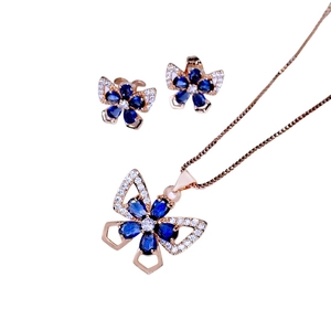 Rose gold butterfly jewelry set featuring dark blue zircon stones and white crystal accents