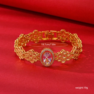 Gold plated floral zircon bracelet with hollow mesh design and oval crystal, length 19.7cm