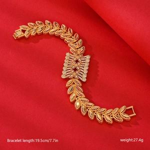 Detailed view of gold leaf bracelet with rectangular cubic zirconia and dimensions