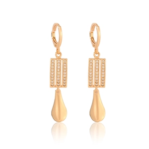 Detailed macro view of rose gold long earrings with micro-pave cubic zirconia and drop pendant