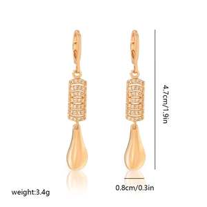 Detail view of gold earrings with cubic zirconia and dimensions 4.7cm x 0.8cm