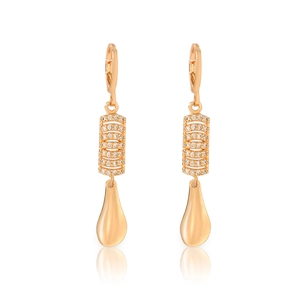 Detail view of gold plated earrings with sparkling zircon stones and drop shape pendants