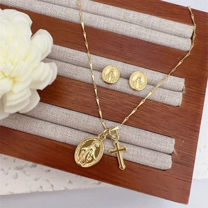 Classic 18K gold plated necklace set with Virgin Mary medal and cross pendant on jewelry box