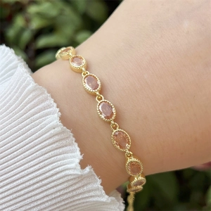 18k gold plated bracelet with orange zircon stones and bead-edge details on wrist