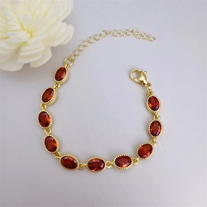 18k gold plated bracelet with oval red zircon stones and adjustable lobster clasp closure
