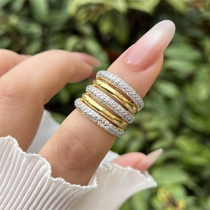 Luxurious 18K gold plated multi-layer ring with sparkling zircon inlays on woman hand