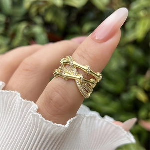 Classic 18K gold plated bamboo multilayer ring with sparkling cubic zirconia on finger