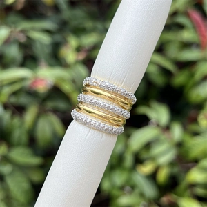 Detailed macro of 18K gold plated multi-layer ring with sparkling zircon inlay