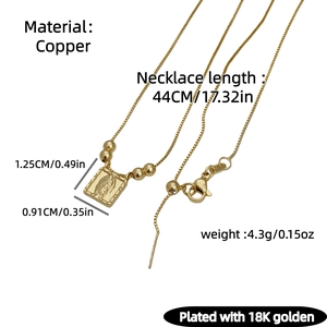 Macro shot of 18K gold plated copper necklace with Virgin Mary pendant and size specs