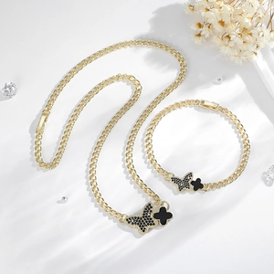 14K gold plated jewelry set with black butterfly and clover charms on thick chains