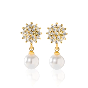 Detail of gold-plated starburst earrings featuring cubic zirconia and white pearls