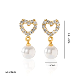 Detailed view of heart-shaped pearl drop earrings with dimensions 2.4cm by 1.0cm