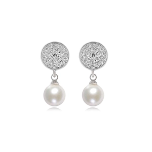 Detailed close-up of a silver pearl earring with a crystal-encrusted round stud