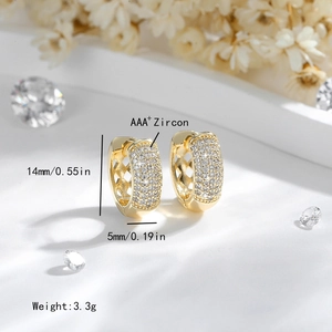 Macro detail of 14K gold plated earrings with AAA+ zircon inlay and mesh hollow design