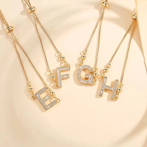 Gold-plated adjustable chain bracelet featuring letters E F G H with micro-set zircon