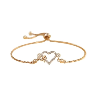 Adjustable gold plated heart bracelet with zircon pavé and bow detail for women