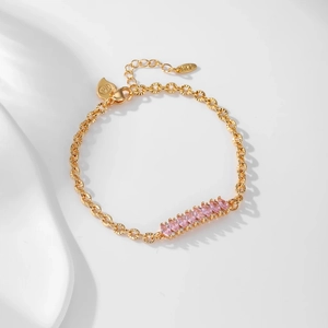Detail of 18K gold-plated chain bracelet featuring pink marquise-cut crystals and clasp