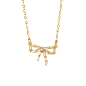 Collier élégant avec pendentif nœud doré et pierres de zircon sur une fine chaîne dorée