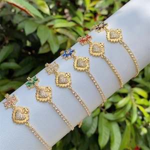 18K gold plated bracelet set with colorful zircon heart and cross charms on white stand