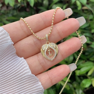 18K gold plated heart necklace with wings and cubic zirconia letter D pendant
