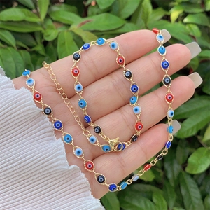 Detail of 18K gold-plated necklace with colorful enamel Evil Eye beads and lobster clasp