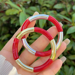 Modern resin bangle set with red tubular segments and gold silver metal accents