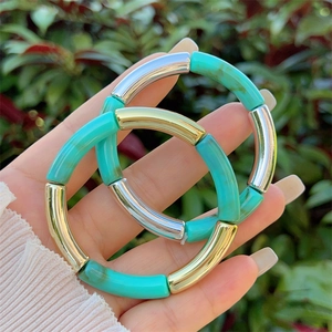 Bamboo-style resin bracelet set with gold metal accents and turquoise marble texture