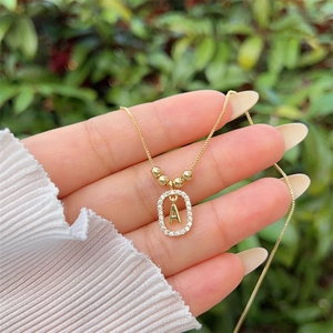 Detailed close-up of 18K gold plated letter A pendant necklace with sparkling zircons