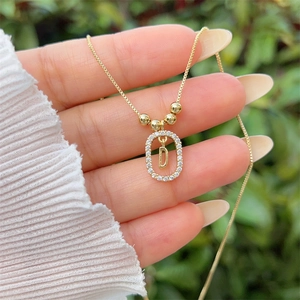 18K gold plated necklace featuring a sparkling zircon paved frame and letter D pendant