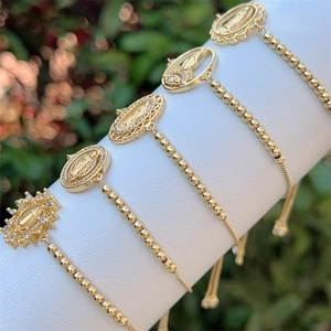 Elegant 18K gold-plated beaded bracelets with Virgin Mary zircon pendants on white display