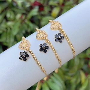 Elegant set of 3 18K gold-plated beaded bracelets with St. Jude and flower charms