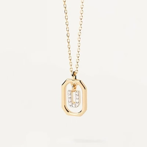 Macro shot of gold square pendant with sparkling letter U and elegant O-chain necklace