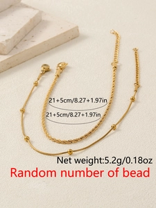 Detail showing gold snake chain and twist rope anklet set with lobster clasp and extension