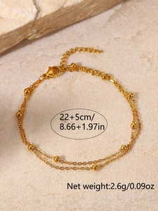 Detail der goldfarbenen Perlen-Fußkette mit Karabinerverschluss und 22+5cm Verlängerung