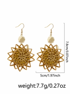 Detail view of handmade woven straw sunflower earrings with precise size measurements