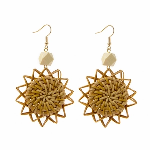 Handmade bohemian woven earrings with geometric wood beads and sun-shaped straw pendants