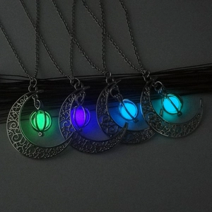 Luminous crescent moon and pumpkin pendant necklace in four vibrant glow colors