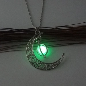 Glowing crescent moon necklace with hollow filigree pendant and green luminous bead