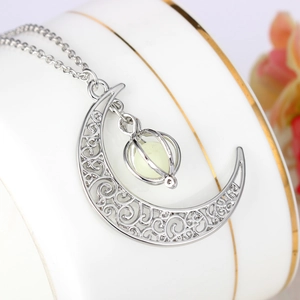 Luminous crescent moon and pumpkin cage pendant necklace with glowing green bead