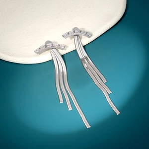 Detailed view of silver butterfly tassel earrings with rectangle zircon and snake chain