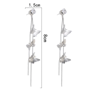 Detail showing dimensions of long silver butterfly tassel earrings with crystals