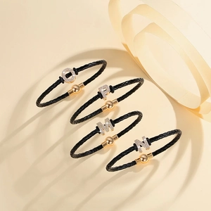 Braided leather bracelet set with rhinestone alphabet letters and magnetic clasp