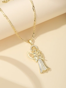 Close-up of golden Santa Muerte pendant with micro-pave cubic zirconia and Figaro chain