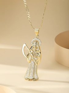 Detail of 14K gold plated Santa Muerte pendant with pave-set cubic zirconia crystals