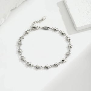 Chic silver star chain anklet with lobster clasp and extension on a clean white background