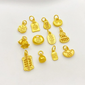 Detailed view of matte gold-plated charms including lotus, gourd, and fortune bag pendants